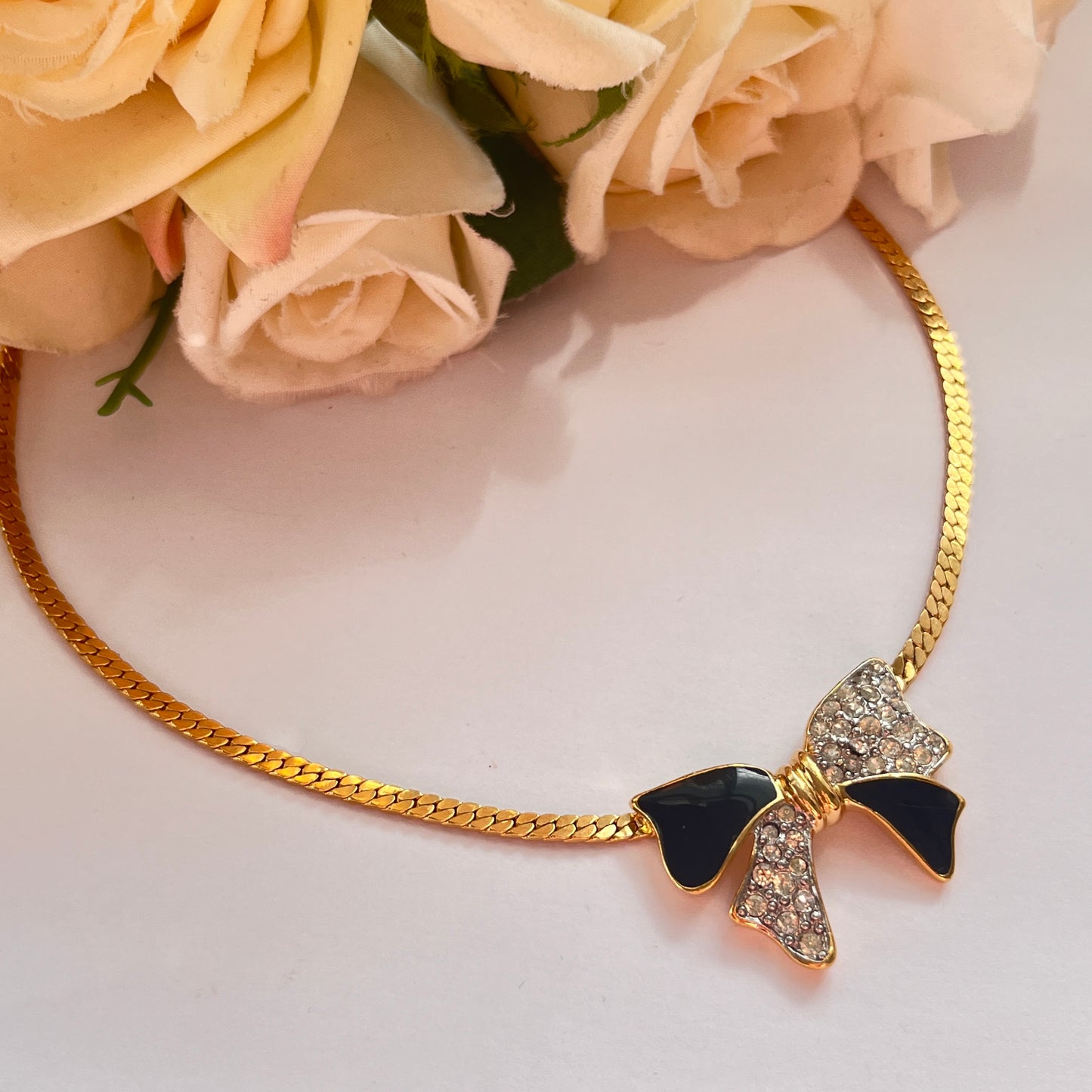 1980s Trifari Diamanté Black Enamel Gold Plated Bow Pendant Necklace
