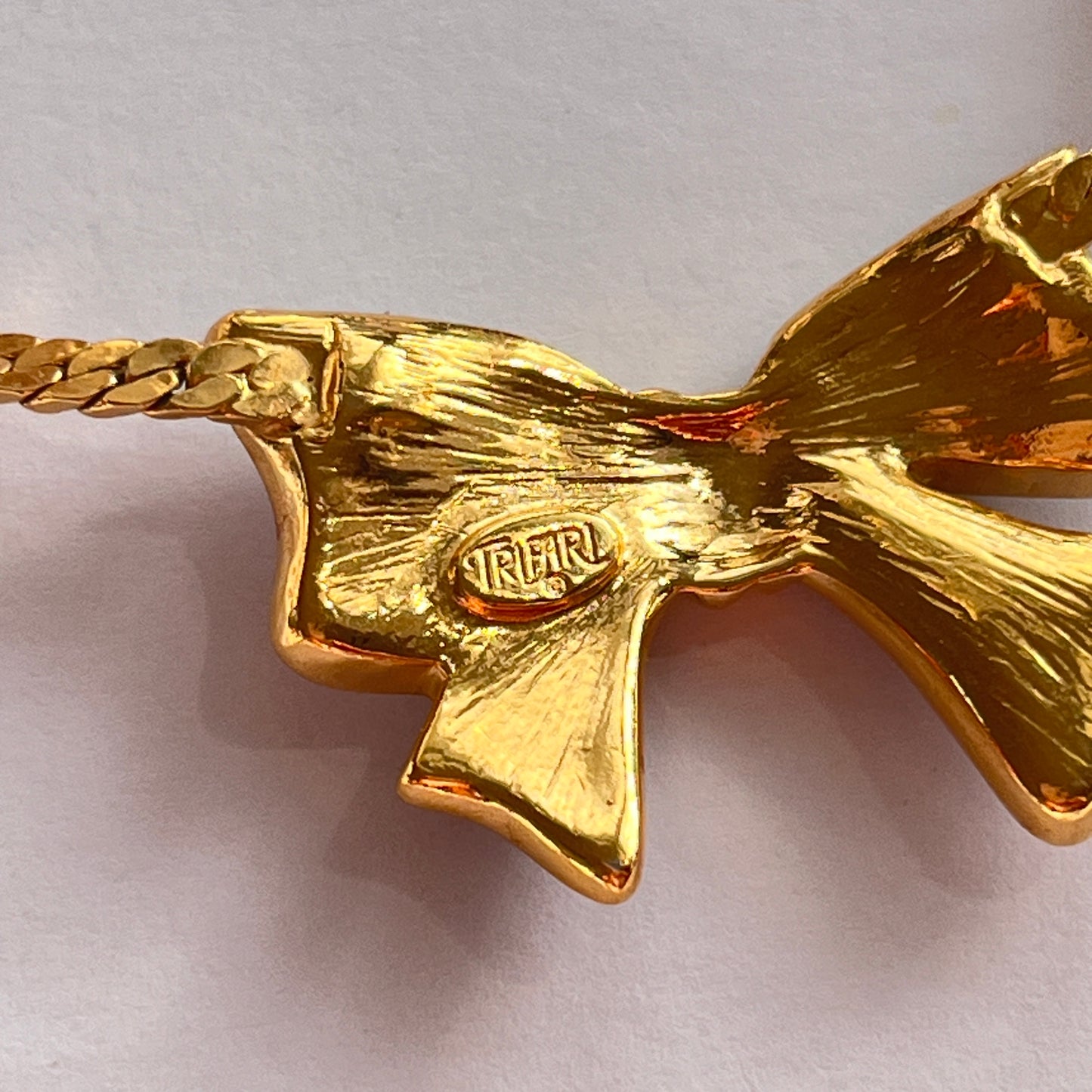 1980s Trifari Diamanté Black Enamel Gold Plated Bow Pendant Necklace